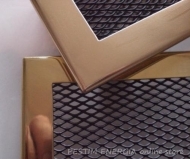 Brass fireplace grille with a wide frame